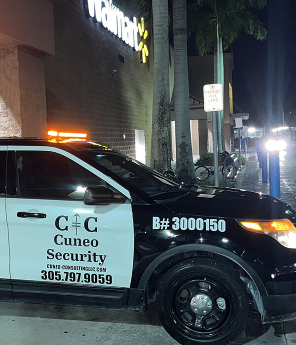 Security vehicle parked outside a retail store at night