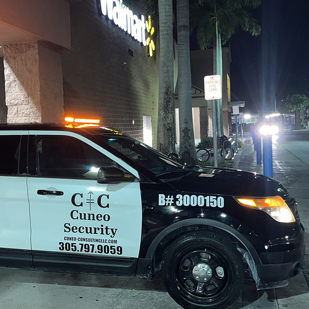 Security vehicle parked outside a retail store at night