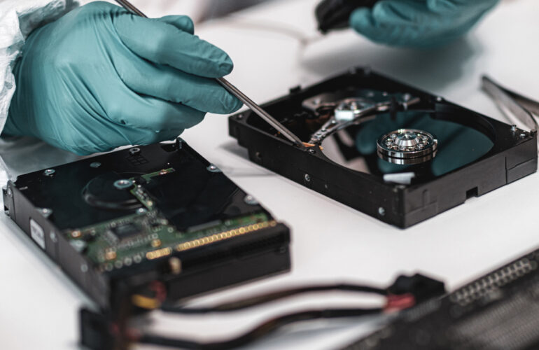 Forensic expert examining a hard drive
